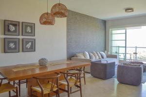 a living room with a table and chairs and a couch at Beautiful Seibal Stay w Vidanta Resort Access in Nuevo Vallarta 