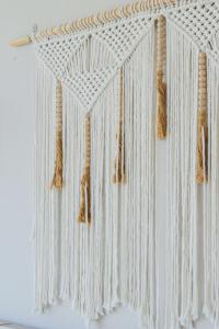 a white curtain with tassels hanging from it at Beautiful Seibal Stay w Vidanta Resort Access in Nuevo Vallarta 