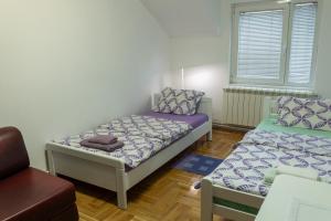 Postel nebo postele na pokoji v ubytování Bubamara house