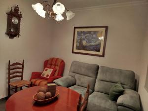 a living room with a couch and a table at Casa tío Manolo in Sinarcas