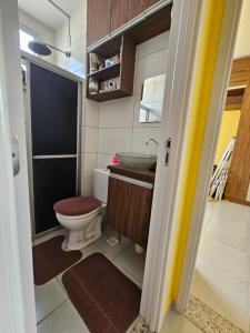 a small bathroom with a toilet and a sink at Residencial Marajoara 1 in Belém