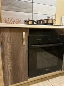 a kitchen with two pots on top of a stove at Maun self-catering unit in Maun +7 photos