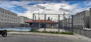 a building with a gate with a pool in it at Residencial Marajoara 1 in Belém