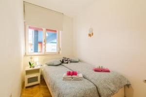 a bedroom with two beds with towels on them at Flexible SelfCheckIns 47 - Zagreb - Two Loggia - New - 3 Bedrooms - 2 WC in Zagreb