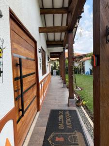 an entrance to a house with a door with a welcome mat at Balcón de Antioquia Exclusiva Villa Campestre con Piscina Privada, Jacuzzi y BBQ en el Eje Cafetero, cerca del Parque del Café in Montenegro +41 photos