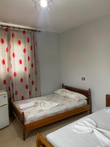 Postel nebo postele na pokoji v ubytování Begaj Rooms