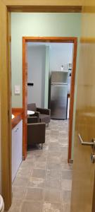 an open door to a kitchen and a living room at Depto Centrico con COCHERA in Trenque Lauquen