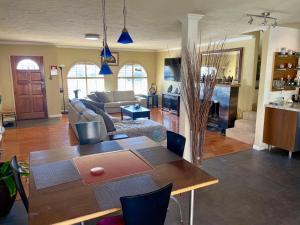 a living room with a table and a couch at Room in Bay Park, San Diego in San Diego +18 photos