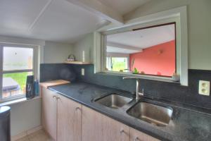 Kuchyň nebo kuchyňský kout v ubytování Poldernest + 23 fotografií