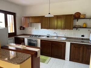 Kuchyň nebo kuchyňský kout v ubytování Casa Casteddina