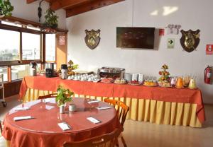 Um restaurante ou outro lugar para comer em Hotel El Marqués