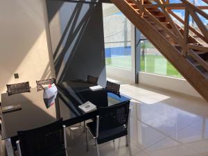 an office with a desk and chairs in a building at Hotel Bonanzza Coxim in Coxim