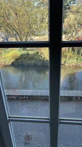 a view of a river from a window at Ferienwohnung direkt an der Lahn in Wetzlar