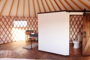 a room with a white door in a yurt at Johnny Yurts - The Pearl in Johnson City