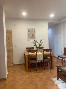 a dining room with a table and chairs at Casa Abuela Cati in Sanlúcar de Guadiana +30 photos