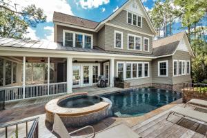 an image of a house with a swimming pool at 161 Flyway Drive by Akers Ellis Rentals in Kiawah Island