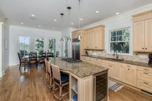 a kitchen with a large island with a counter top at 161 Flyway Drive by Akers Ellis Rentals in Kiawah Island