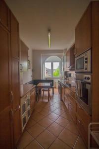 a large kitchen with a table and a dining room at Ferienwohnung Glaser in Pforzheim