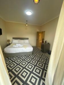 Voodi või voodid majutusasutuse Jazal Pyramids View Hotel toas