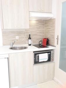 Η κουζίνα ή μικρή κουζίνα στο Valentina Central Studio +6 φωτογραφίες