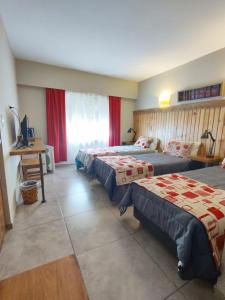 Postel nebo postele na pokoji v ubytování Hostal El Korú