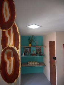 a room with a shelf with some donuts on it at VILA LEME Casa 11 in Rio de Janeiro
