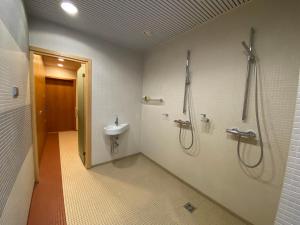a bathroom with a shower and a sink at Kakumäe Raba Villa - Luxury Private Spa Villa in Tallinn in Tallinn