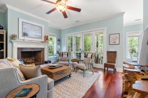 a living room with a couch and a fireplace at 253 Governors Drive by Akers Ellis Rentals in Kiawah Island