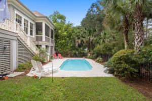 a swimming pool in the yard of a house at 253 Governors Drive by Akers Ellis Rentals in Kiawah Island