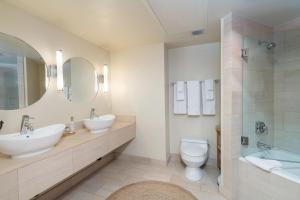 a bathroom with two sinks and a toilet and a shower at Ice House 203 by Exceptional Stays in Telluride +21 photos
