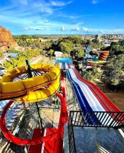 a ride at a theme park with a slide at Spazzio 631 Diroma COM CLUBE GRATIS TODO DIA in Caldas Novas +6 photos