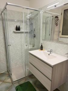 a bathroom with a shower and a sink at Casa Vacanze Maride in Capitana +21 photos