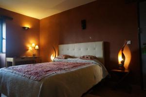 Postel nebo postele na pokoji v ubytování Hotel Le Saint Jean