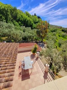an overhead view of a patio with a bench and stairs at Da Alfonsina in Castellabate