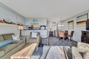 a living room with a couch and a table at Winds VI F3 by Carolina Beach Realty in Carolina Beach +38 photos