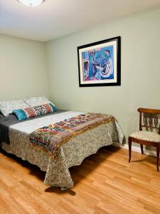a bedroom with a bed and a chair at Comfy & Family Friendly in Central San Diego in San Diego +37 photos