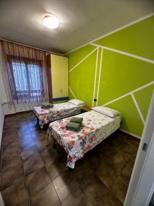 Postel nebo postele na pokoji v ubytování Beppo’s Domus
