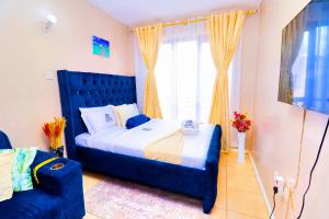 Postel nebo postele na pokoji v ubytování Enac Homes - Decorous, Classy & Elegant Executive Studios - Kiambu Road