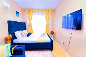 Postel nebo postele na pokoji v ubytování Enac Homes - Decorous, Classy & Elegant Executive Studios - Kiambu Road