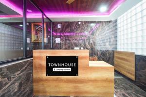 a view of a room with a townhouse sign on a counter at Super Townhouse Kokapet Formerly Aarian Tej Nilayam in Hyderabad