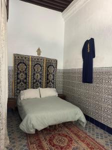 Postel nebo postele na pokoji v ubytování Riad Zahara