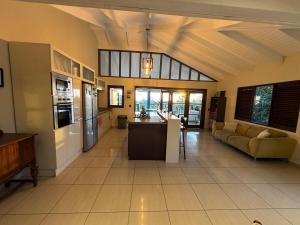 a large room with a kitchen and a living room at Seaview Oasis in Gated Community and Walk to Beaches in Willemstad
