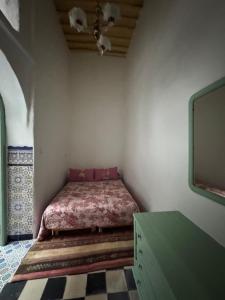 Postelja oz. postelje v sobi nastanitve Riad Zahara