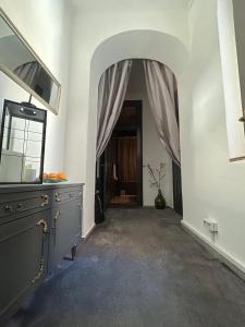 a hallway with a dresser and a mirror in a room at Flow - City Centre Zadar in Zadar
