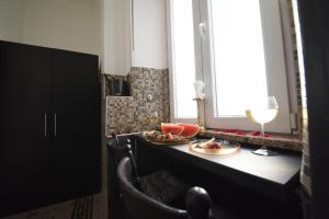 a table with two plates of food and a glass of wine at Flow - City Centre Zadar in Zadar +4 photos