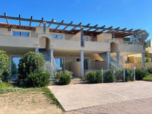 a house with a staircase in front of it at Da Marta Appartamento VISTA MARE MOZZAFIATO ISOLA ROSSA in Cascabraga