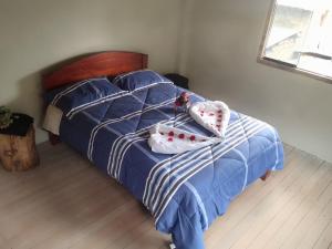 Postel nebo postele na pokoji v ubytování Rumi Wasi Hostel