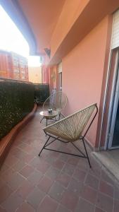 a bench and a table on a patio at Appartement sur Guéliz in Marrakech