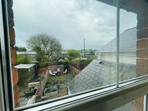 a view from a window of a yard at Market Hall in Kington +1 photo