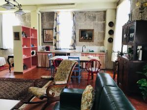 a living room with a table and chairs at Casa Bella para peregrinos- Charm House for pilgrims in A Guarda